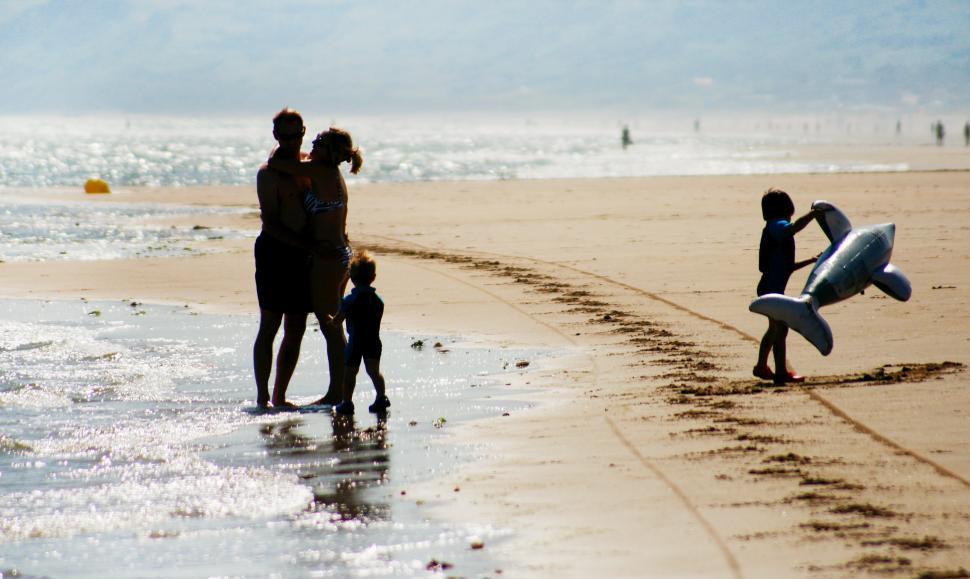 Free Image of Happy family on the beach 