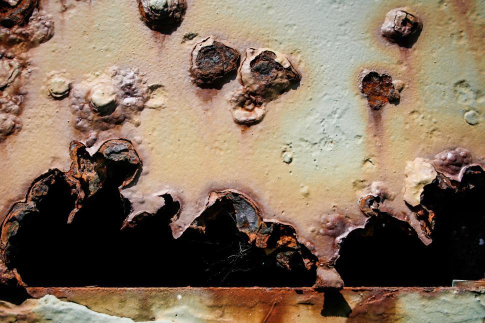 Free Image of Bullet holes in rusty metal 