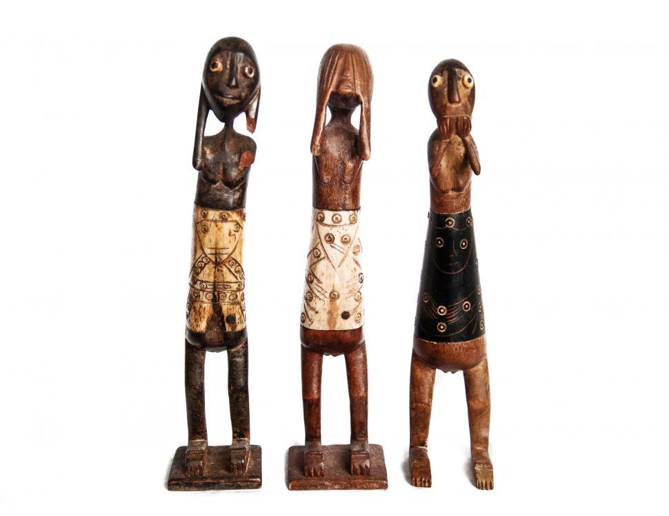 Free Image of See hear speak no evil wooden statues 