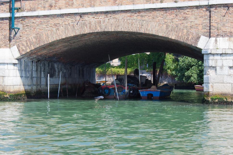 Free Image of Boats moored under bridge 