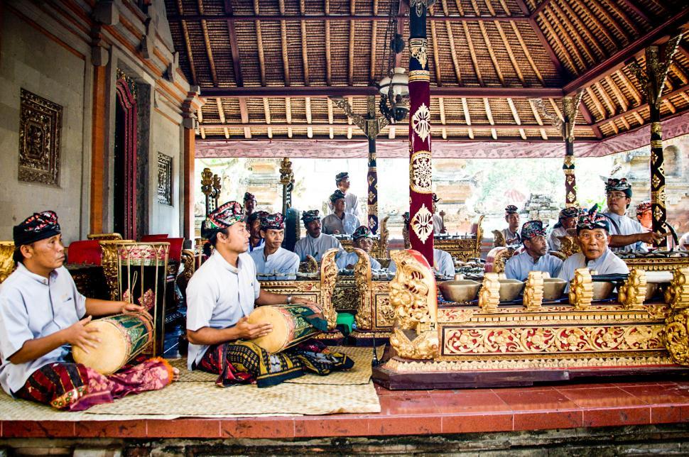 Free Image of Men play traditional gamelan percussion  
