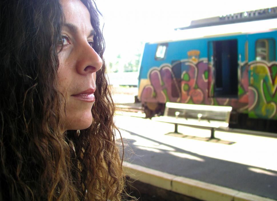 Free Image of Woman waiting for train at station 