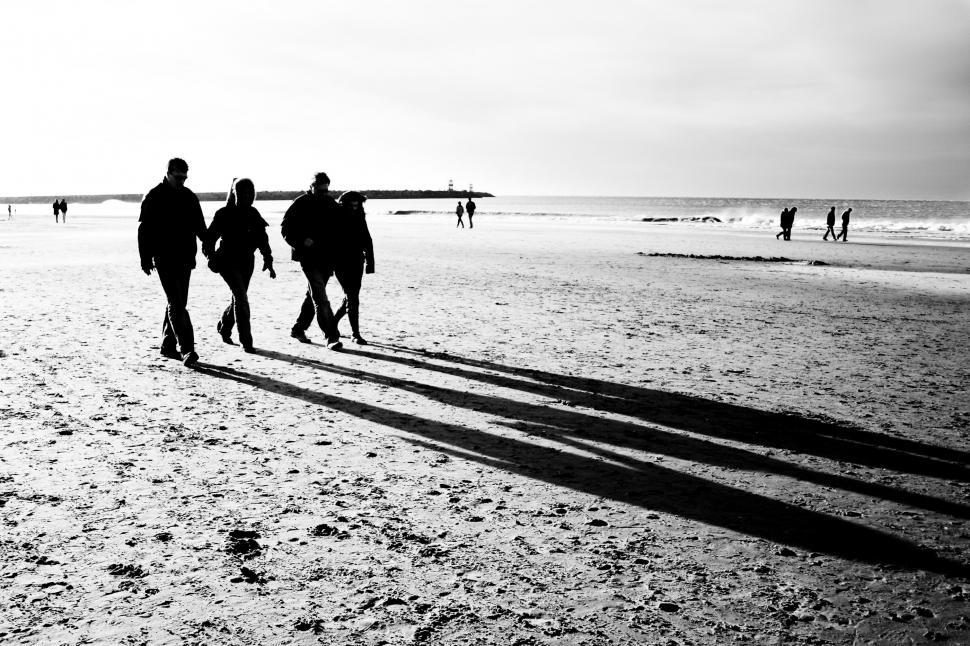 Free Image of People walking on the beach 