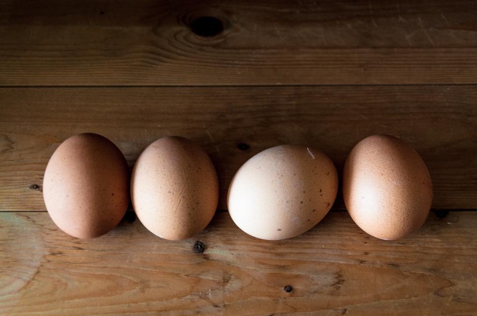 Free Image of Eggs on wood background 