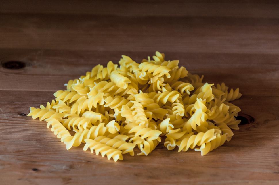 Free Image of Fusilli pasta on a old wooden background 