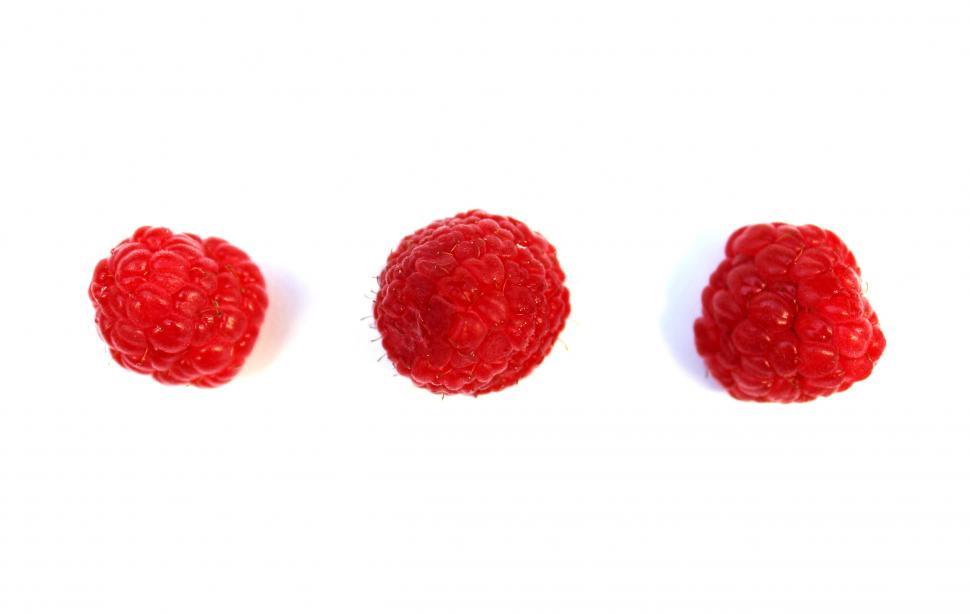 Free Image of Three raspberries on white background 