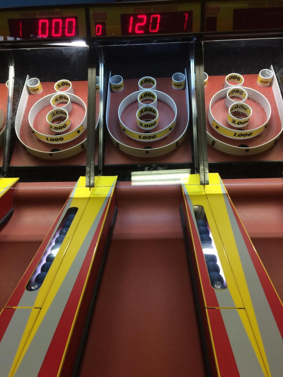 Free Image of Row of Red and Yellow Machines With Numbers 