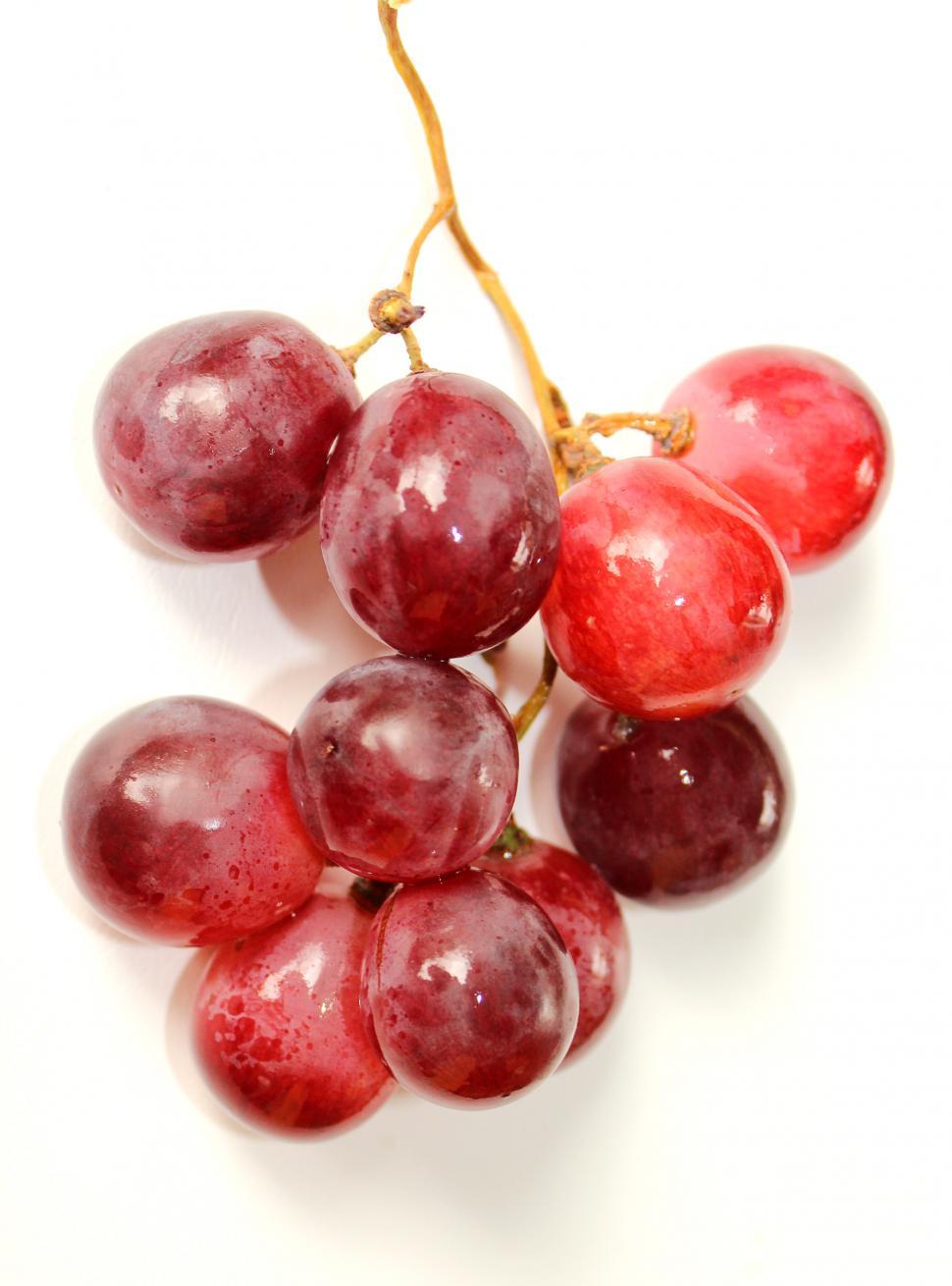 Free Image of Bunch of red globe grapes on white 
