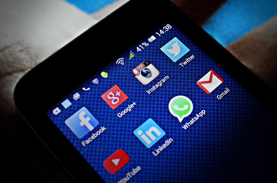 Free Image of Showing social media icons on smartphone 
