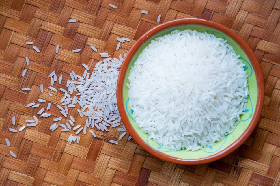 Free Image of Bowl of White Rice on Wooden Floor 
