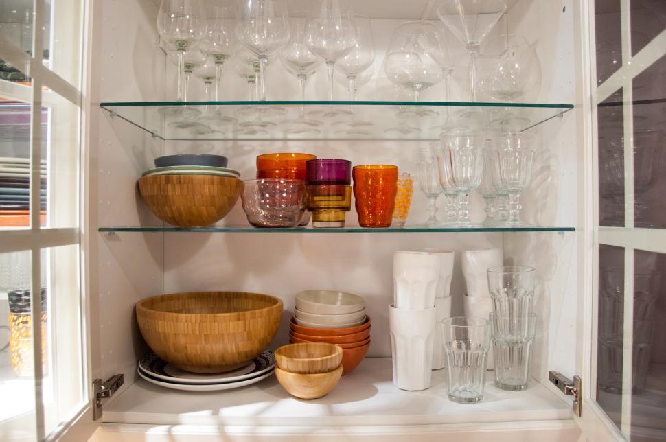 Free Image of opened cupboard with kitchenware inside 
