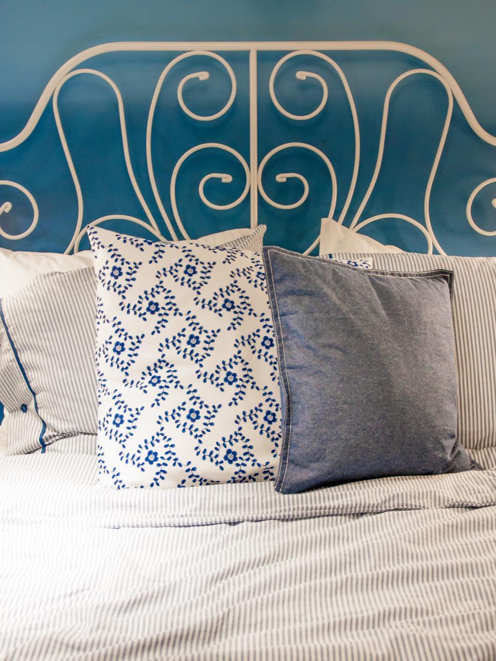 Free Image of bed with blue linen in the bedroom 