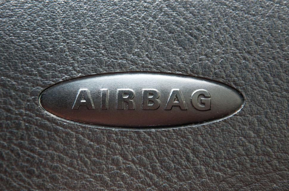 Free Image of lose up of airbag steering wheel symbol 