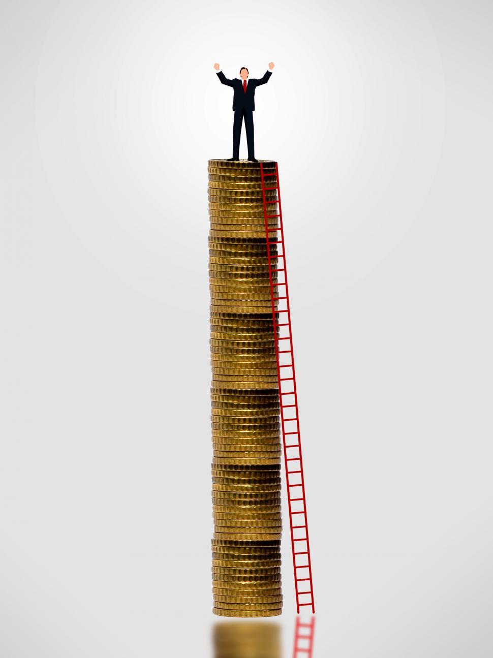 Free Image of Businessman on top of gold coin stack - Wealth growth concept 