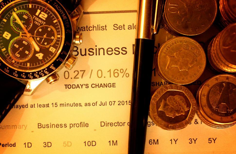 Download Free Stock Photo of Money with pen and watch on financial data - Finance Concept 