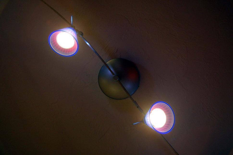 Free Image of light fixture track bulb ceiling below blue electric 