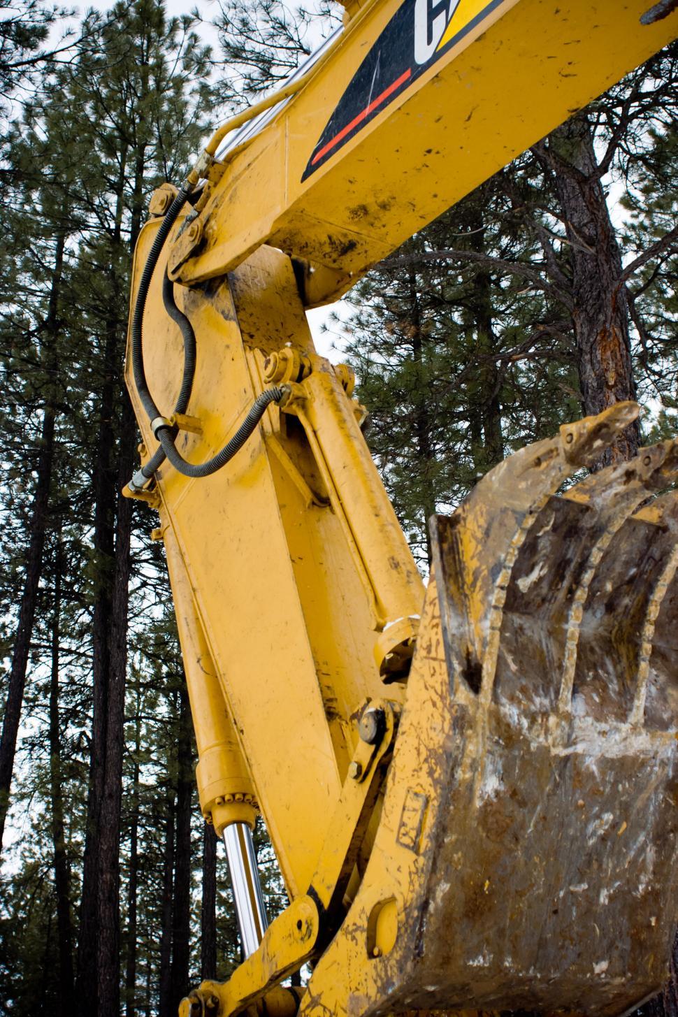 Free Image of Close Up of a Yellow Bulldozer in a Forest 