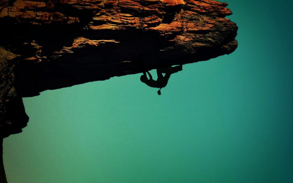 Download Free Stock Photo of Silhouette of a rock-climber 