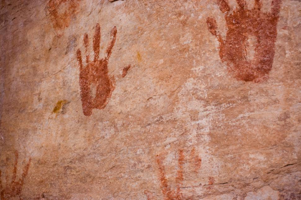 Free Image of Two Hand Prints on the Side of a Rock 