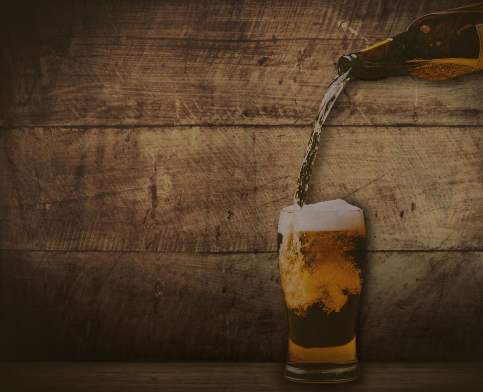 Free Image of Pouring beer - washed out vintage looks with copyspace 