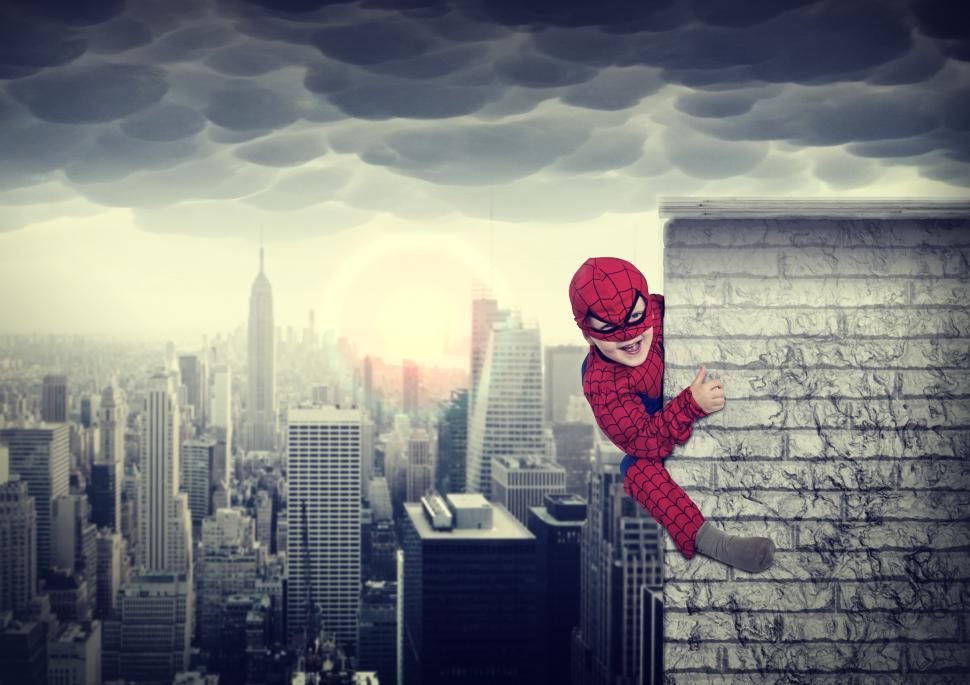 Download Free Stock Photo of Young boy dreams of being a superhero - Child imagination and cre 