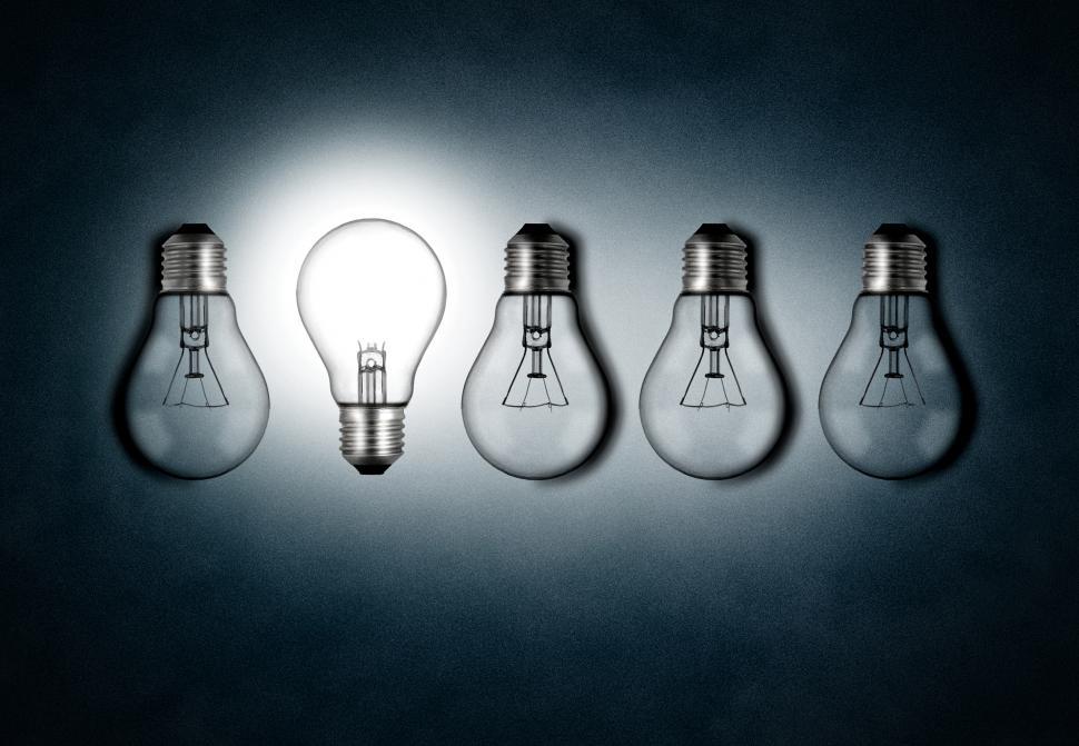 Free Image of Illuminated lightbulb amid dim bulbs - creativity and innovation 