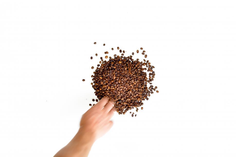 Free Image of Hand in the coffee beans 