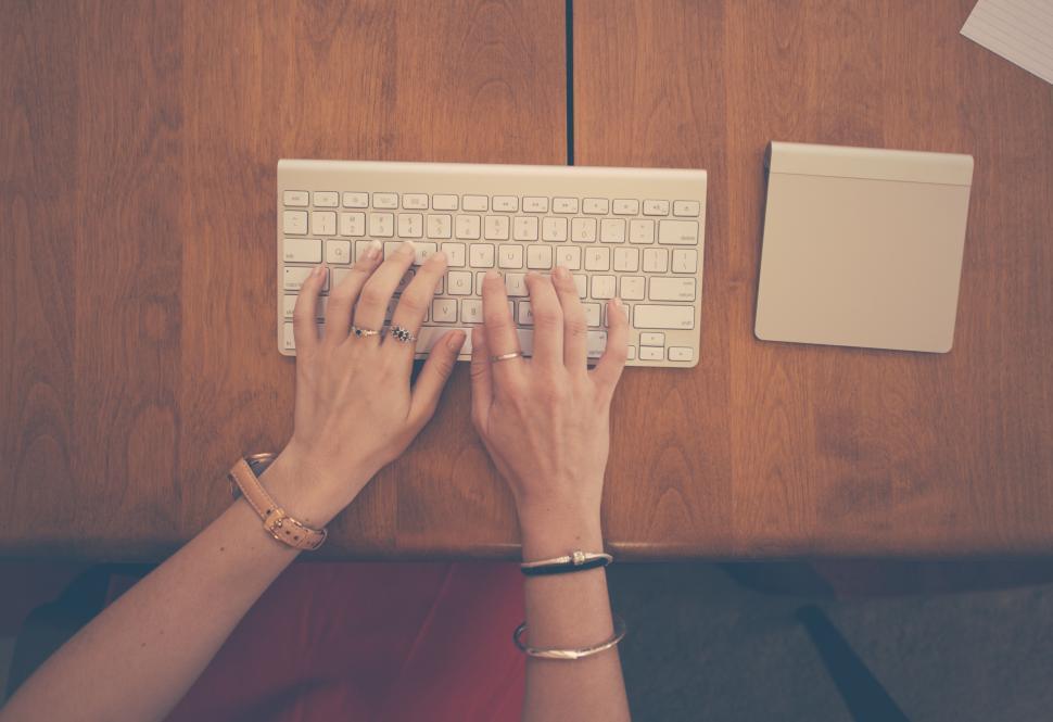 Free Image of Hands typing on keyboard 