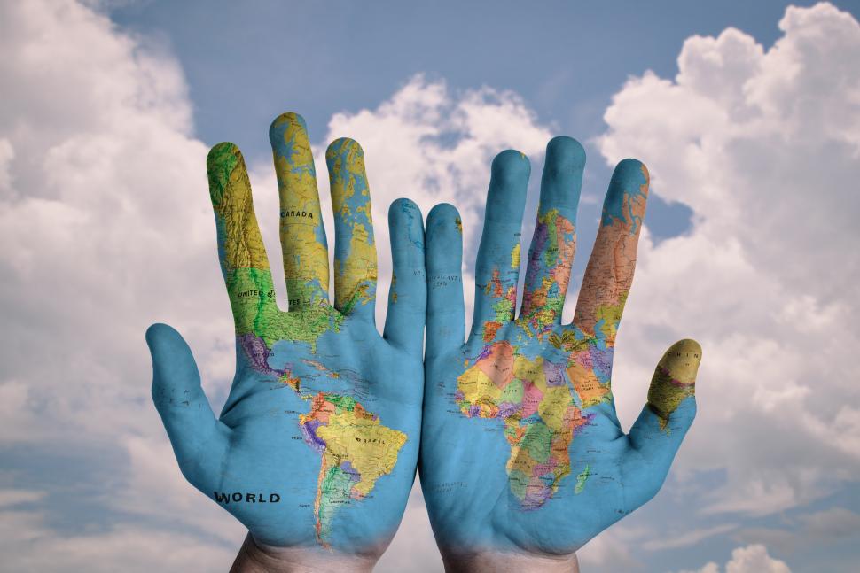 Download Free Stock Photo of World map on hands 