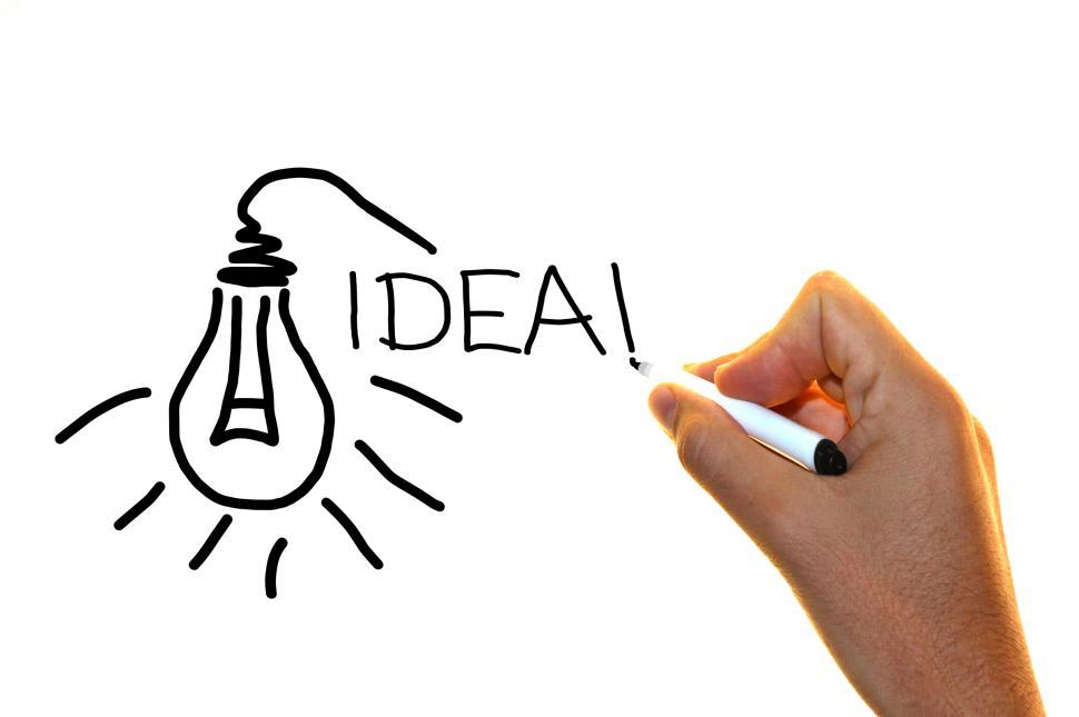Free Image of Hand drawing the word idea with lightbulb sketch 