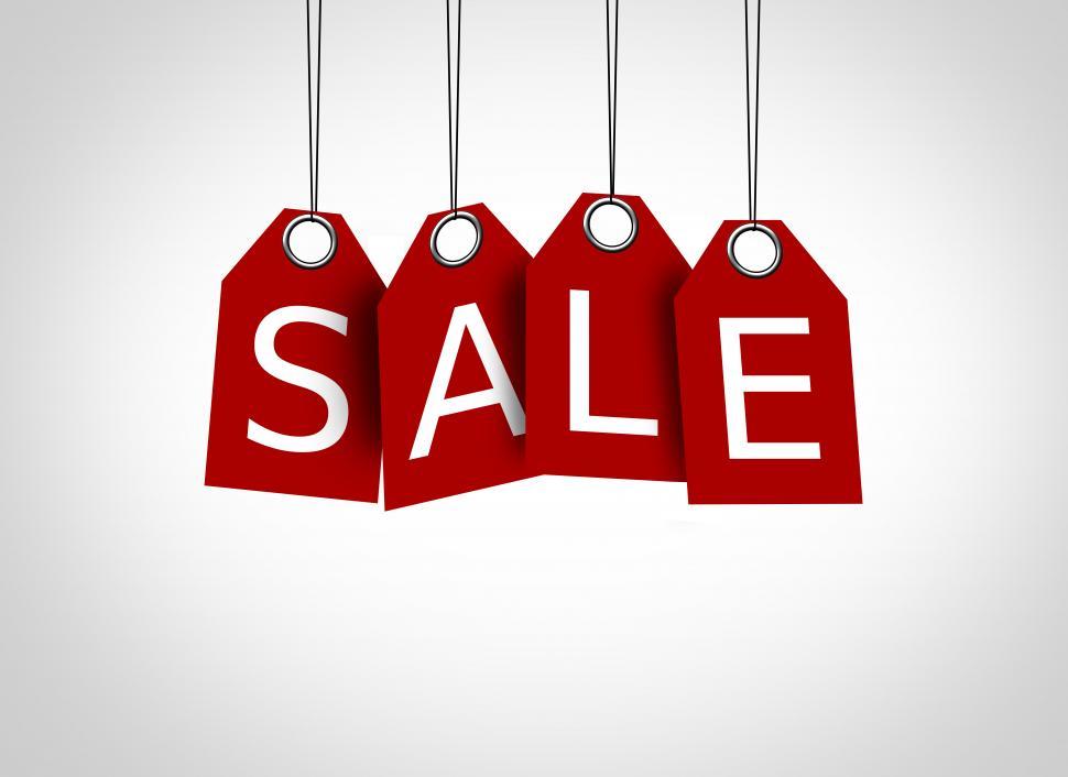 Free Image of Red tags dangling with the word sale - Sales concept 