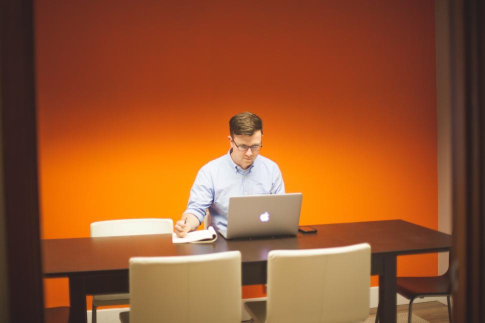 Free Image of Working in an orange room 