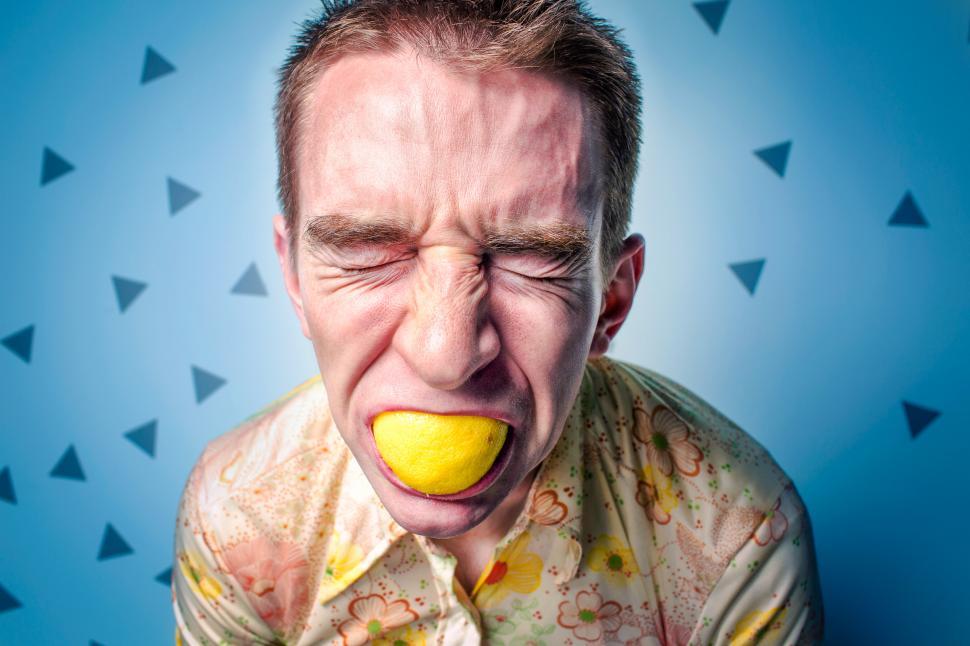 Free Image of Man With Lemon In Mouth 