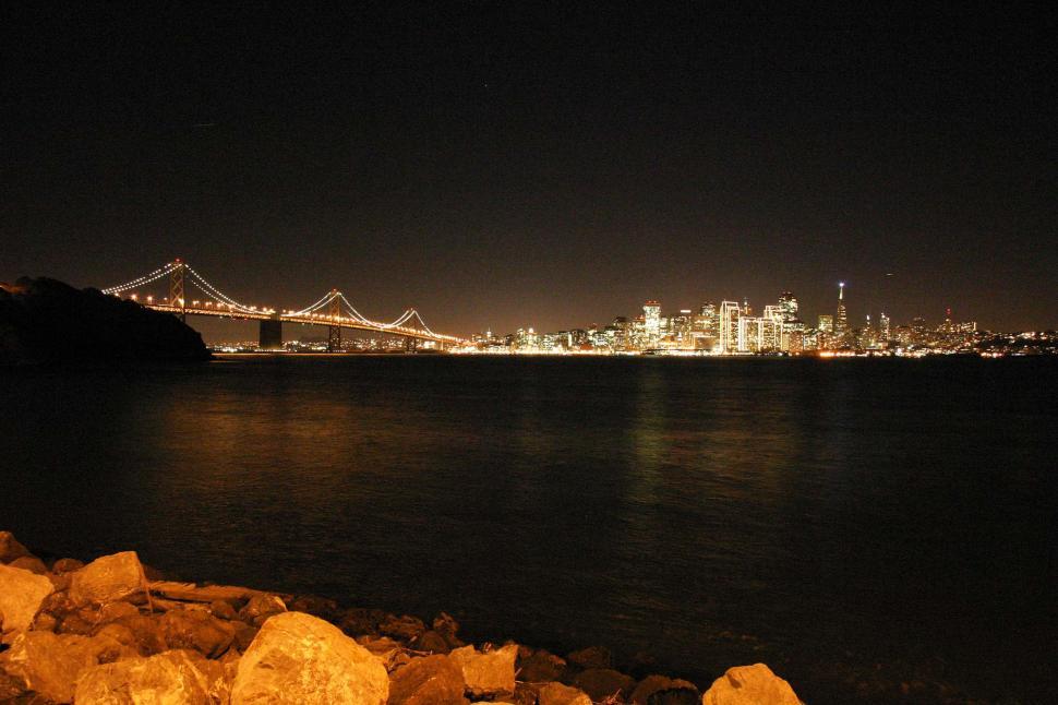 Free Image of san francisco california sunset city pacific ocean bay downtown night lights bridge treasure island skyline 