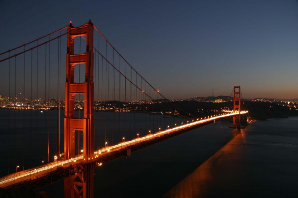 Free Image of golden gate bridge san francisco span california sunset landmark cable city pacific ocean bay headlights reflection water 