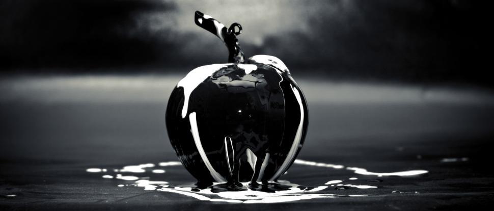 Free Image of Apple with a liquid poured on it 