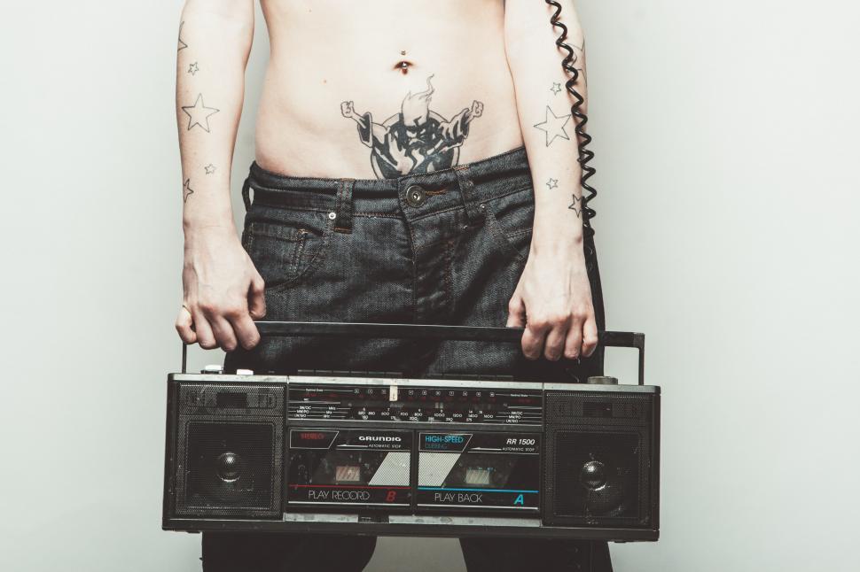Download Free Stock Photo of Tattooed Man with Tape recorder 
