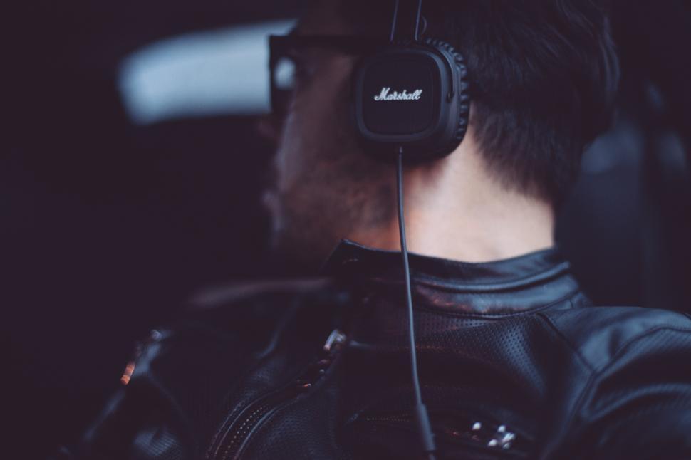 Free Image of Man Wearing Headphones in the Dark 