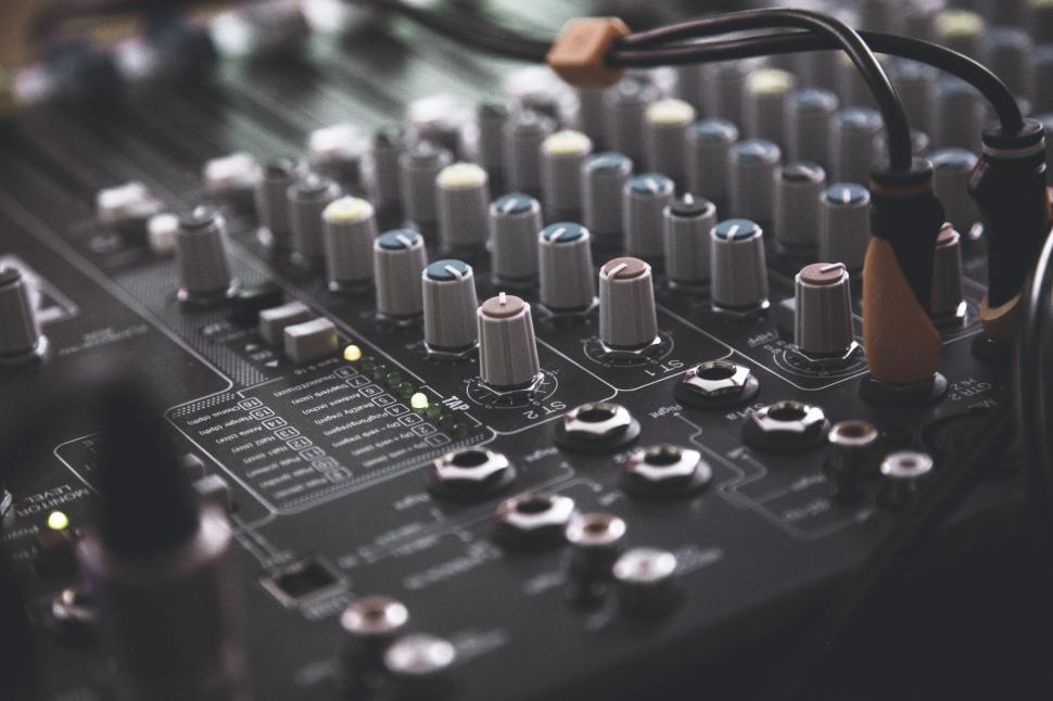 Free Image of Close Up of a Mixing Board With Knobs 