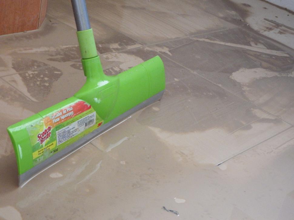 Free Image of Cleaning up a dirty floor  