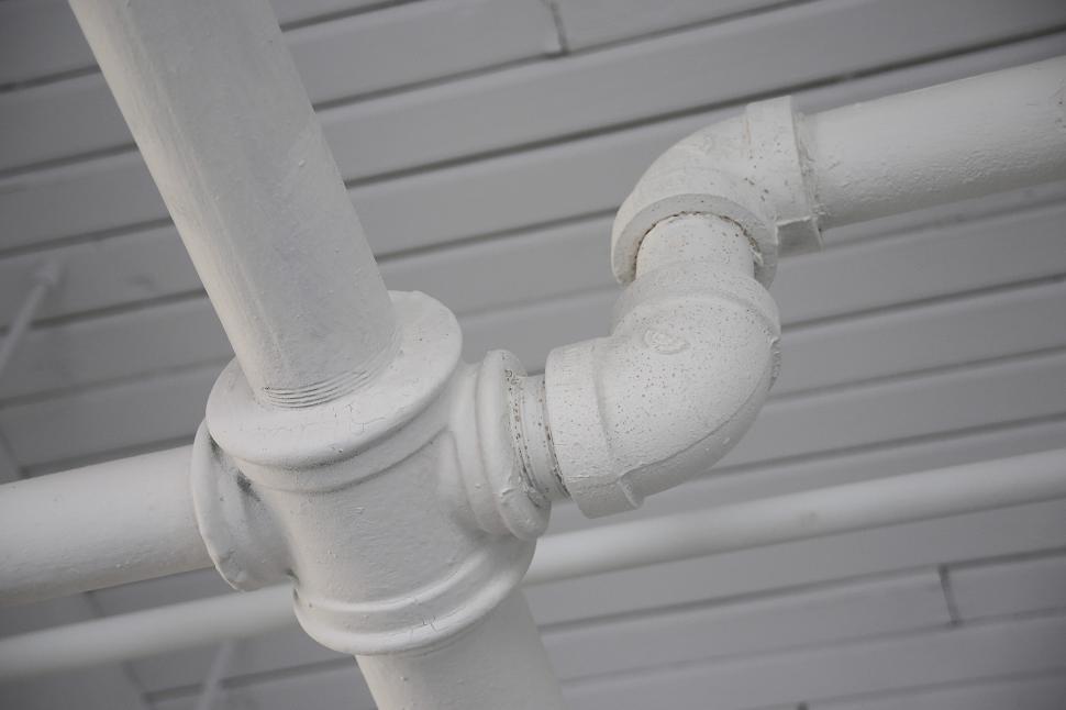 Free Image of Close Up of a White Pipe on a Wall 
