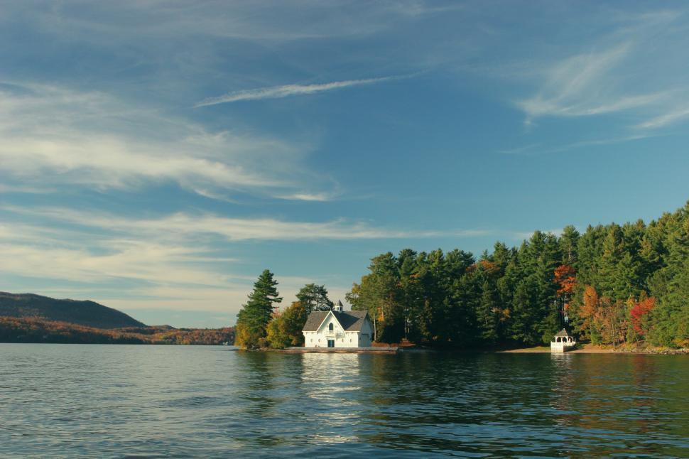 Free Image of House on a Lake Surrounded by Trees 