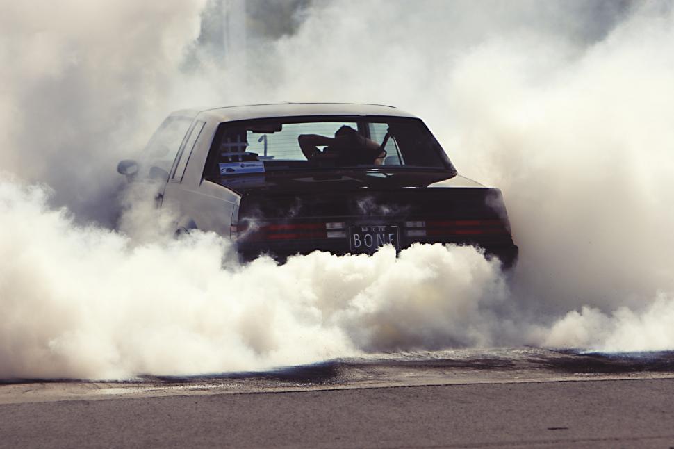 Free Image of Car Driving Through Heavy Smoke 
