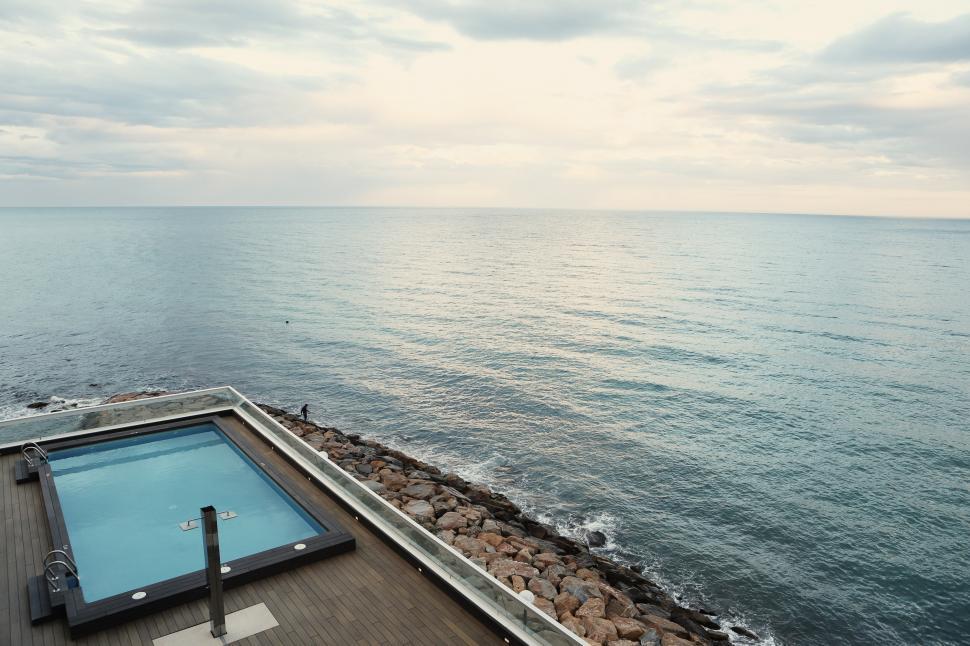 Free Image of Large Swimming Pool on Wooden Deck 