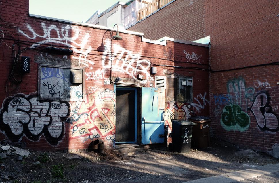 Free Image of Graffiti-Covered Brick Building 