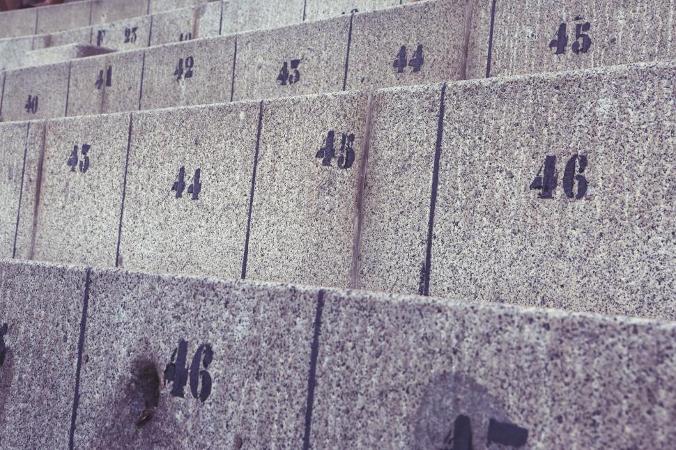 Free Image of Row of Cement Blocks With Numbers 