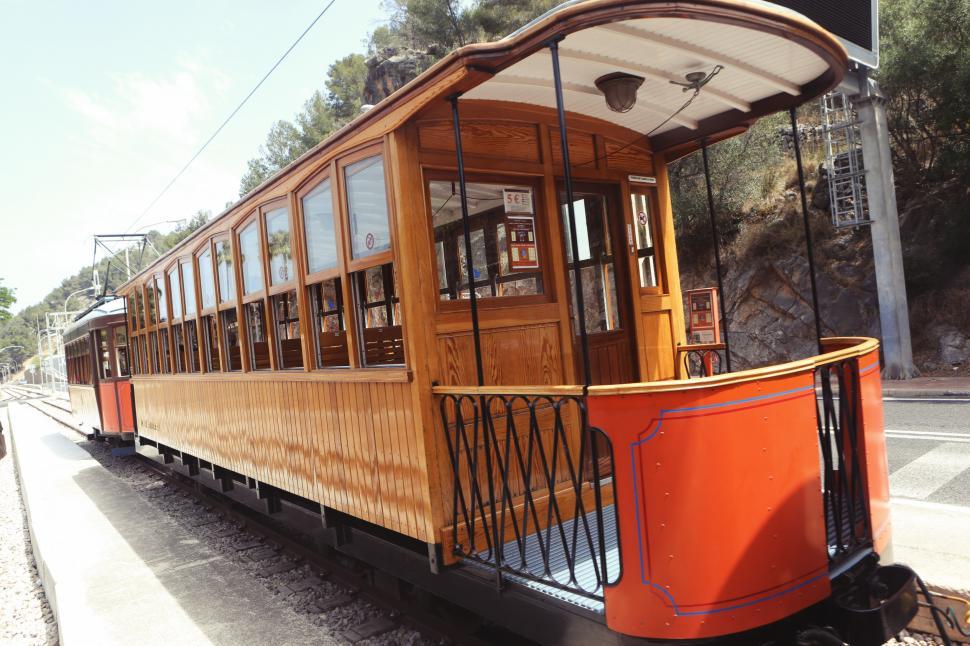 Free Image of Orange Trolley Car on Tracks 