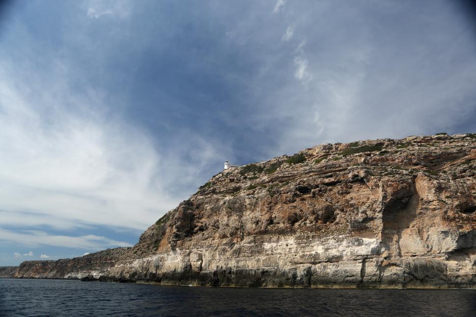 Free Image of Boat View of Cliff 