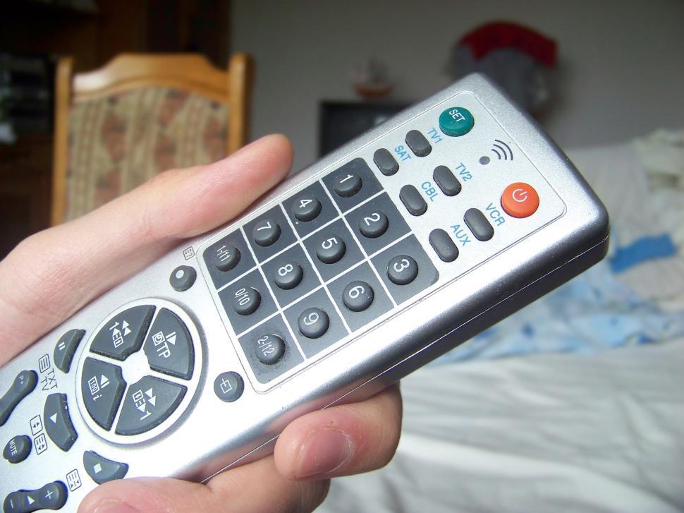 Free Image of TV remote control in hand  