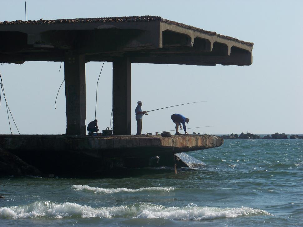 Free Image of Fishermen on the old wharf in Mamaia  